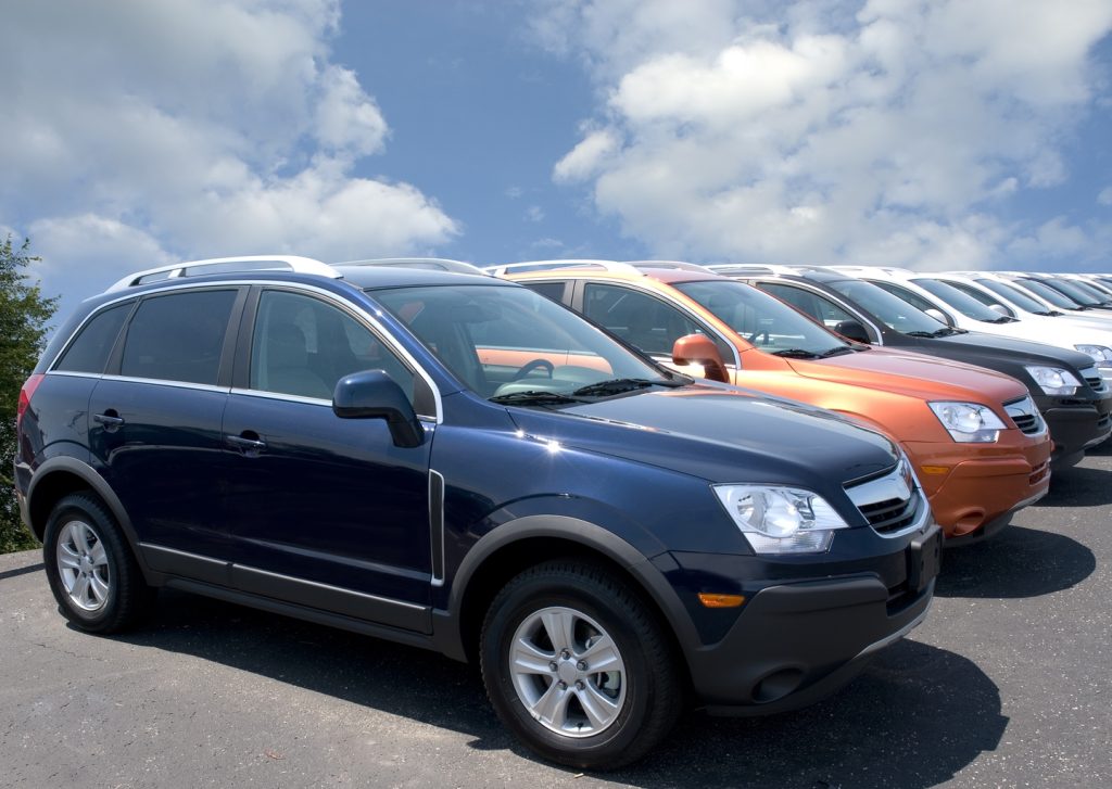 500px Photo ID: 98985513 – New fuel efficient SUV’s on a car dealers lot for sale.